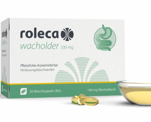 ROLECA_Schale_mit_Kapseln ROLECA Wacholder Faltschachtel Hintergrund